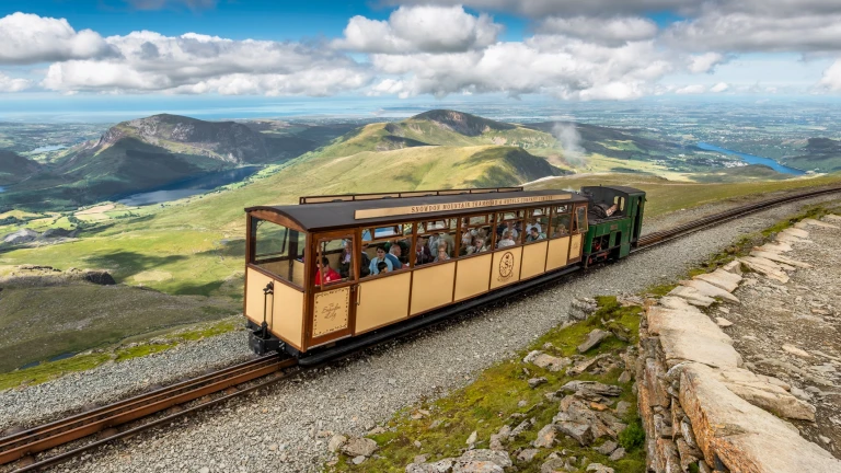 Snowdon Lily carriage going up the Snowdon Mountain Railway.