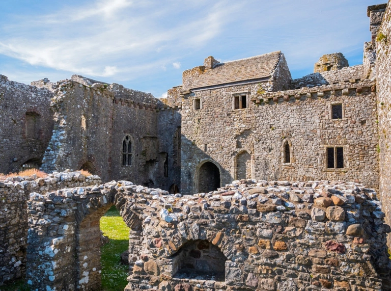 The inner courtyard of a well preserved stone castle.