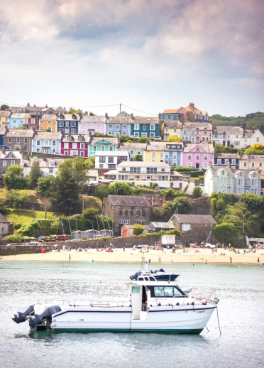Boat trip with the backdrop of the the pretty quaint seaside village