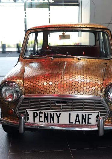 A Mini covered in coins at The Royal Mint Experience.