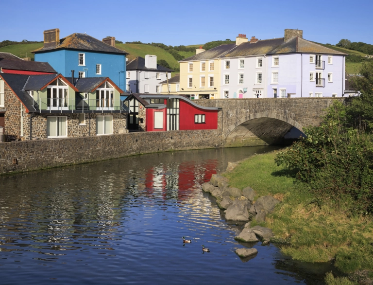 Houses alongside a river bank.