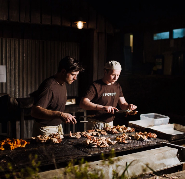 Chefs cooking at Fforest.
