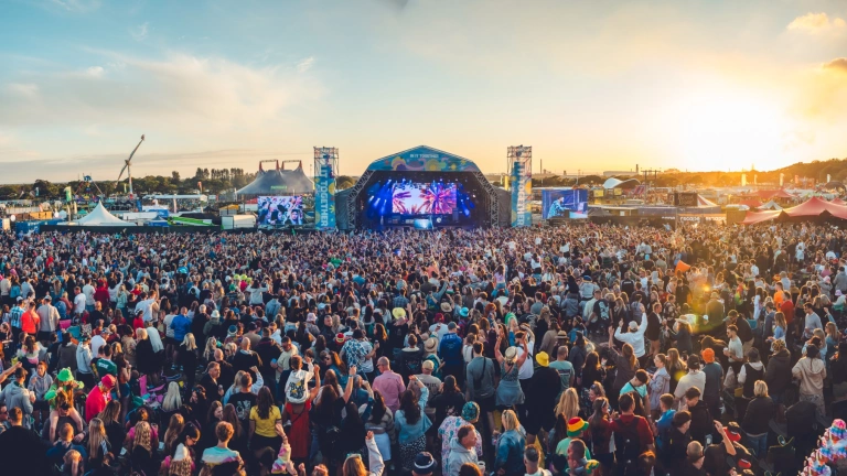 crowd and stage at festival.