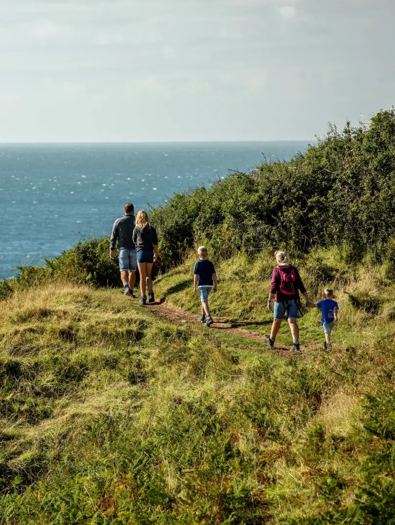 Family walking on coastal path at Aberdaron.