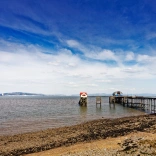 A pier jutting out into the sea.